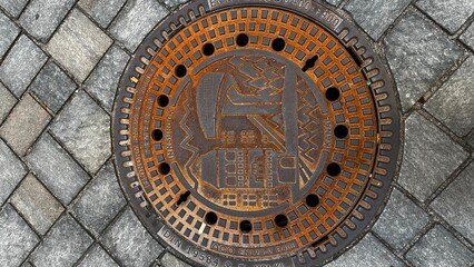 manhole cover on the pavement