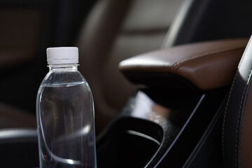 Drinking water in the car prepared for traveling