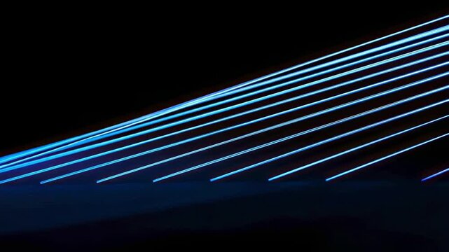 Luminous blue parallel lines cut diagonally across a black void casting a faint glow on a dark surface at the bottom