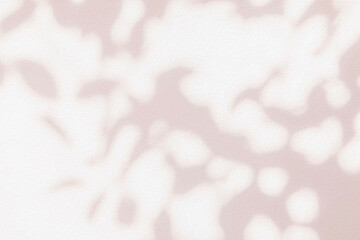 Light and shadow pink beige pastel abstract background. Natural leaves shadows and sunshine diagonal refraction on white wall texture. Shadow overlay effect foliage mockup, banner graphic layout