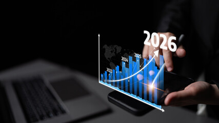 A professional analyzing growth trends using a smartphone to view an interactive graph that...