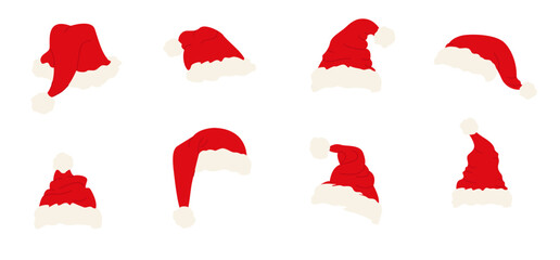 A set of red Santa hats of various shapes on a white background. A festive Christmas headdress with white fur trim and a pom-pom. A traditional Christmas element.