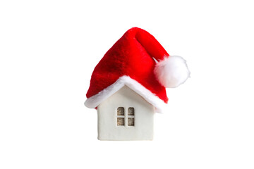 Small decorative house ornament with frosted white walls, Santa hat roof, single window, winter holiday decor, isolated on a transparent background