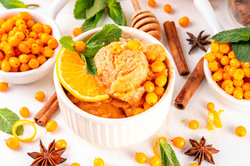Tasty autumn sea buckthorn ice cream, sweet and sour hippophae gelato or sorbet with orange zest, honey and spices