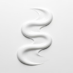 Naklejka premium A swirl of white cream isolated on white background