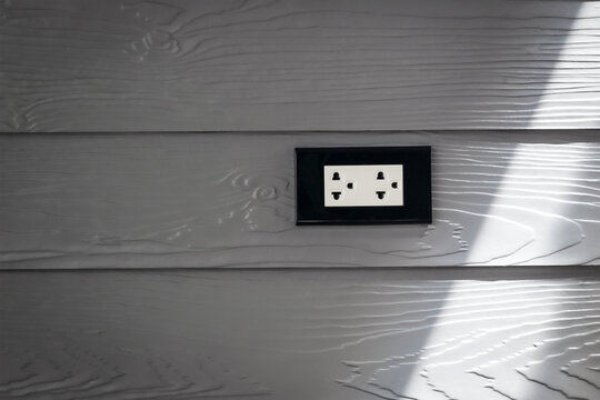 Gray wooden wall mounted electrical outlet