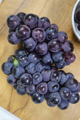 Bunch of dark blue grapes. Fresh Concord grapes, Healthy fruits.