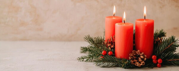 festive arrangement featuring three red candles surrounded by pine branches, pine cones, and berries, evoking a warm holiday atmosphere.