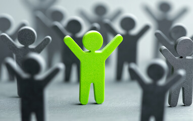 Green figure of man with raised arms on background of grey human figures.