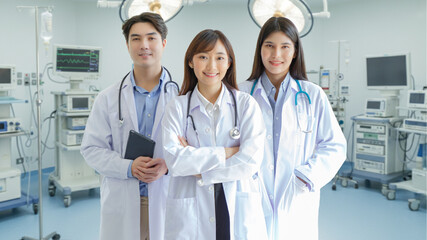 Medicine and healthcare concept : Group of happy and cheerful asian doctors Line up, Male and Female are smiling in Operating Room.