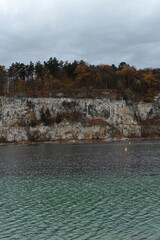Cliffs and Autumn Forest Reflected in Zakrzowek Quarry Lake, Krakow