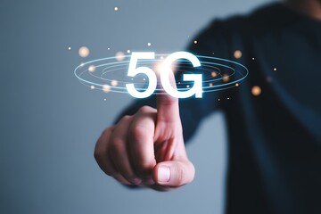 A person s finger touches a glowing 5g logo surrounded by a digital network of glowing particles and orbits