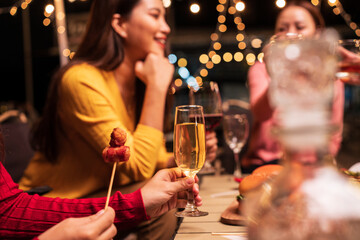 young couple celebrating with champagne at night