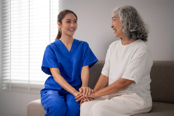 Obraz premium Asian adult nurse caregiver supporting older senior woman homecare companionship comfort happiness elderly support living