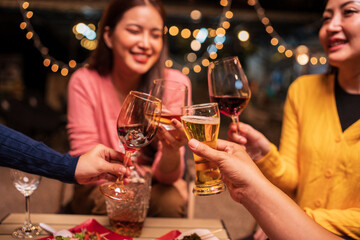 young couple celebrating with champagne at night