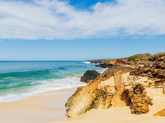 The Rocky Shoreline Under Black Rock Cinder Cone on Pohakumauliuli Beach, Molokai, Hawaii, USA