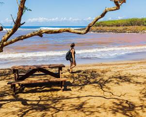 Female Hiker Walking on The Red Dirt at Dixie Maru Beach, Molokai, Hawaii, USA