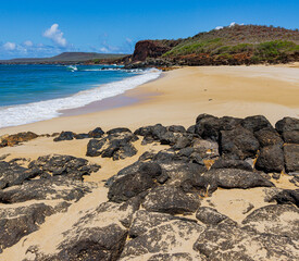 Volcanic Rock and White Sand With Black Rock Cinder Cone on Pohakumauliuli Beach, Molokai, Hawaii, USA