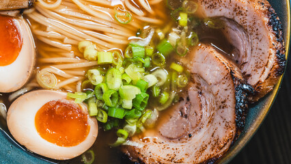 Delicious pork chashu ramen with tender marinated pork, tamago egg, and bamboo shoots in a beautiful bowl. Rich broth, perfect for Japanese cuisine lovers.
