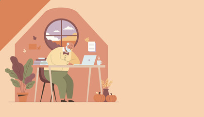 Elderly man remotely working on laptop in a cozy attic autumn setting
