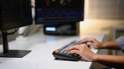 Photo Set of Close up A young trader working with financial charts on a computer at home, Future job opportunities in digital markets and stock exchange