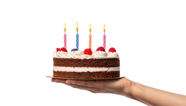 A hand holding a delicious birthday cake with lit candles, perfect for a celebration. The cake has white frosting and red fruit