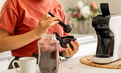 Fototapeta premium Woman Making Coffee In Coffee Machine