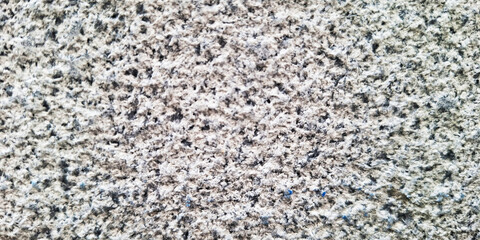 Close Up Texture Of Speckled Granite Stone With Subtle Pink And Green Hues Creating A Natural Abstract Pattern