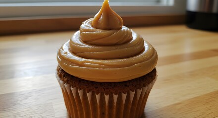 Sweet and Festive Dulce de Leche Swirl Topping a Cupcake