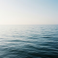 Peaceful ocean surface stretching to the horizon, bathed in soft, natural light, creating a soothing and expansive aquatic scene ,still ,background ,light