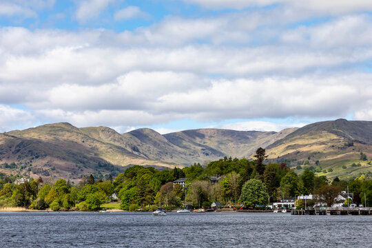 ambleside lake district cumbria uk from lake windermere showing the fairfield horseshoe and the fells great rigg fairfield and dove crag sunny spring day no people