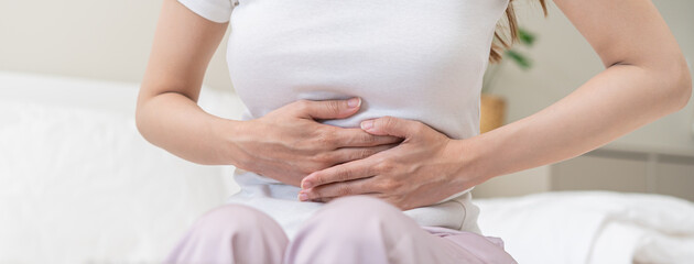 Flatulence ulcer, asian young woman, girl hands in belly, stomach pain from food poisoning,...