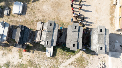 Ahead of the funeral of the King of Pau, the arriving family expressed their condolences, walking among the megalithic grave stones 