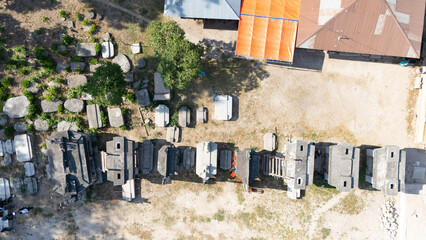 Megalithic graves made of large stones in Umabara Pau village,east sumba, seen from the air. 