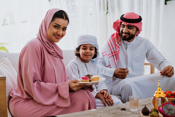 Arab family celebrating together and smiling