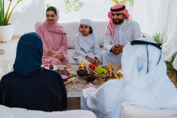 Emirati family at home. Muslim family sharing iftar at countryside home.