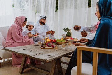 Emirati family at home. Muslim family sharing iftar at countryside home.
