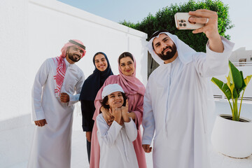 Arab family making selfie outdoors during daytime