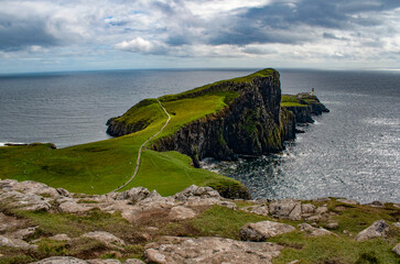 Scotland, Uk: aerial view of the sheer cliff of Neist Point lighthouse (1909), famous promontory and viewpoint on the most westerly point on the Duirinish peninsula on the Isle of Skye
