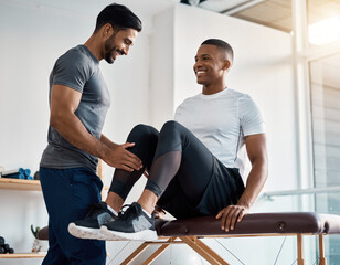Physiotherapist doing exercise with patient