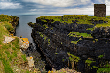 Scotland, Uk: panoramic view of the Castle of Old Wick (the Old Man of Wick), ruined castle on a spine of rock projecting into the North Sea and surrounded by sea cliffs near the town of Wick
