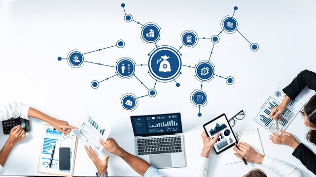 A dynamic office scene showcasing a team collaborating on data visualization with technology tools, enhancing decision-making strategies for effective business development. Amity