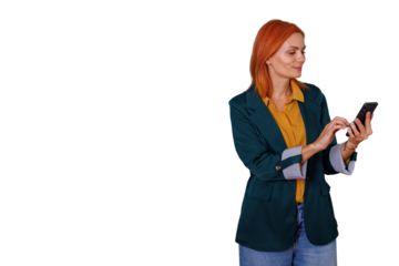 Woman with red hair smiling and texting on smartphone, using mobile application for communication or social media