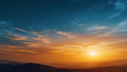 Obraz premium Dramatic Sky At Dusk: A Stunning Summer Landscape Of Golden Sunlight, Blue, Orange And Yellow Clouds, With A Beautiful Sunrise Over The Mountain Horizon.