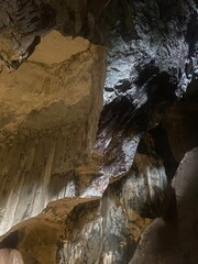 Mystical Underground Cave with Stalactites and River