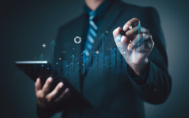 Businessman using tablet and digital pen analyzing data with virtual graph, representing business growth, financial analytics, and digital technology innovation concept.