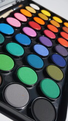 Multicolor eyeshadow palette isolated on white background close up