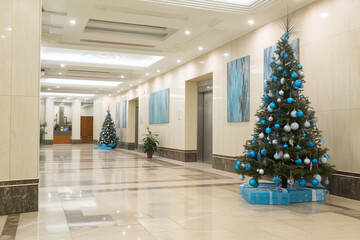 Christmas workplace decoration, office lobby with tree, professional but festive, corporate