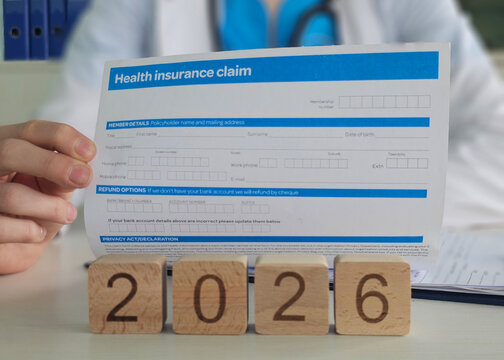 Health insurance claim form filled out by a medical professional in an office setting in 2026
