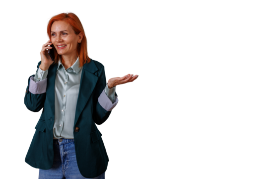 Woman with red hair talking on a smartphone, making a hand gesture, expressing communication and remote work concept